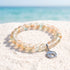 Save the Dolphins Recycled Glass Bracelet – Dolphin Pendant With 8mm Frosted Gold-Speckled Glass Beads - Orange Blue - Approx. 6.93"/17.6cm - image 8