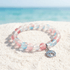 Save the Dolphins Recycled Glass Bracelet – Dolphin Pendant With 8mm Frosted Gold-Speckled Glass Beads - Red Blue - Approx. 6.93"/17.6cm - image 2