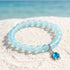 Save Marine Animals Turtle Bracelet - Recycled 8mm Frosted Sea Glass Beads With Crystal Turtle Pendant - Light Blue - Approx. 6.93"/17.6cm - image 2