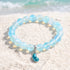 Supports Marine Life Ocean Drop Bracelet - Recycled 8mm Frosted Sea Glass Beads With Blue Teardrop Charm - Light Blue - Approx. 6.93"/17.6cm - image 2