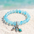 The Ocean Trio Charms Bracelet - Recycled 8mm Frosted Sea Glass Beads To Saves Marine Life - Light Blue - Approx. 6.93"/17.6cm - image 2