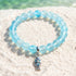 Supports Ocean Animal Rescue Bracelet - Recycled 8mm Frosted Sea Glass Beads With Blue Scaled Fish Charm - Light Blue - Approx. 6.93"/17.6cm - image 2