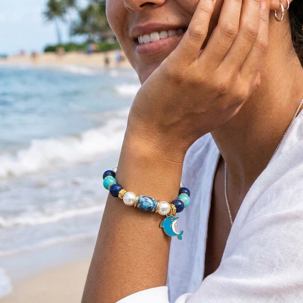 FREE Today: Save The Dolphin Family Stretch Bracelet - Ocean Blue Beaded Bracelet With Dolphin Charm - image 1
