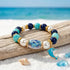 FREE Today: Save The Dolphin Family Stretch Bracelet - Ocean Blue Beaded Bracelet With Dolphin Charm - Dolphin - 6.3" / 16cm (Stretchable) - image 0