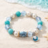 FREE Today: Pearl Shell Charm Octopus Barrel Beaded Bracelet - Ocean Themed Jewelry for Marine Conservation - Shell - 6.3" / 16cm (Stretchable) - image 0
